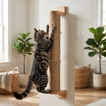 Tabby cat stretching and scratching the wall-mounted wooden sisal cat scratcher